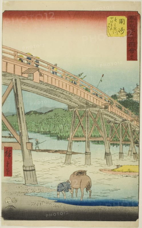 Okazaki: Yahagi Bridge on the Yahagi River (Okazaki, Yahagigawa Yahagi no hashi), no. 39 from the series Famous Sights of the Fifty-three Stations (Gojusan tsugi meisho zue), also known as the Vertical Tokaido, 1855, Utagawa Hiroshige ?? ??, Japanese, 1797-1858, Japan, Color woodblock print, oban, 36.8 x 22.5 cm (14 1/2 x 8 7/8 in.)