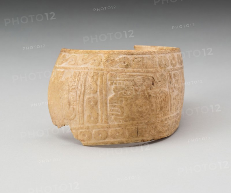 Shell, Possibly an Arm Band, Incised with Profile Head Framed by Geometric Motifs (Frament), c. A.D. 1200, Possibly Mixtec, Oaxaca or Guerero, Mexico, Guerrero state, Shell, 6.7 x 8.9 cm (2 5/8 x 3 1/2 in.)