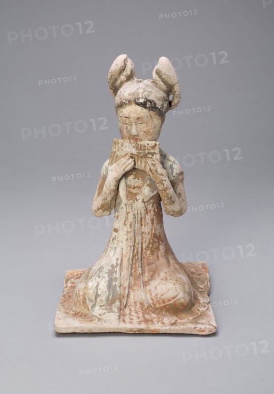 Female Musician, Tang dynasty (A.D. 618–907), late 7th/early 8th century, China, Earthenware with polychrome pigments, 20.6 × 13.1 × 13.2 cm (8 1/8 × 5 3/16 × 5 3/16 in.)