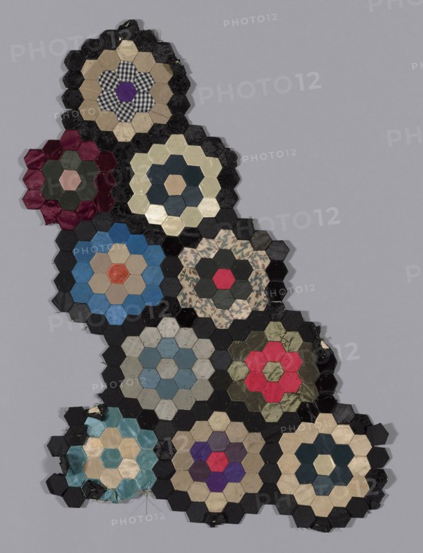 Fragments from Bedcover (Mosaic or Honeycomb Quilt), 1876, United States, a: Silk and cotton, plain, twill, and satin weaves, some with patterning warps, some with patterning and brocading wefts, some self-patterned, and some with cut solid velvet, some warp painted (chiné), pieced over paper, 23 x 46 cm (11 1/2 x 20 in.)