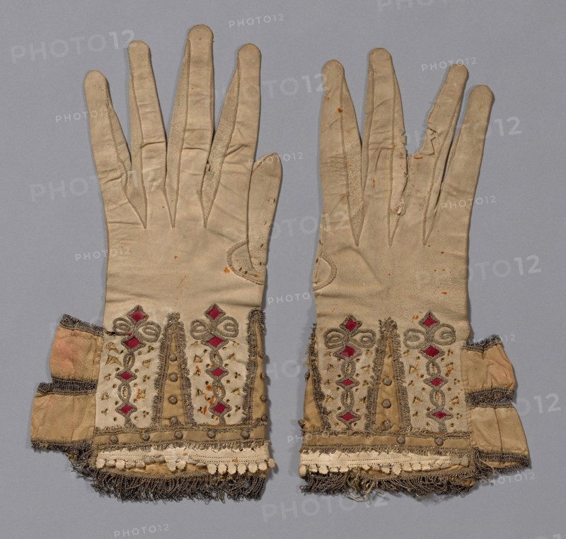 Pair of Gloves, 1601/50, England, Leather, cut, pricked and slashed, silk satin appliqué, gilt-metal-strip-wrapped silk couching, gilt-metal-strip-wrapped silk woven fringe, balls covered with gilt-metal-wrapped-silk, ribbons of silk, plain weave edged with gilt-metal-strip-wrapped silk woven fringe, lining: silk, plain weave, interlining: linen, plain weave, a: 30 × 14.6 cm (11 3/4 × 5 3/4 in.)