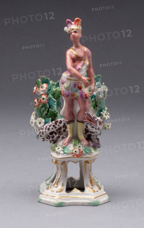 Figure of America, c. 1766, Bow Porcelain Factory, London, England, 1744-1775, Bow, Soft-paste porcelain, polychrome enamels and gilding, 14.3 × 5.4 × 5.4 cm (5 5/8 × 2 1/8 × 2 1/8 in.)