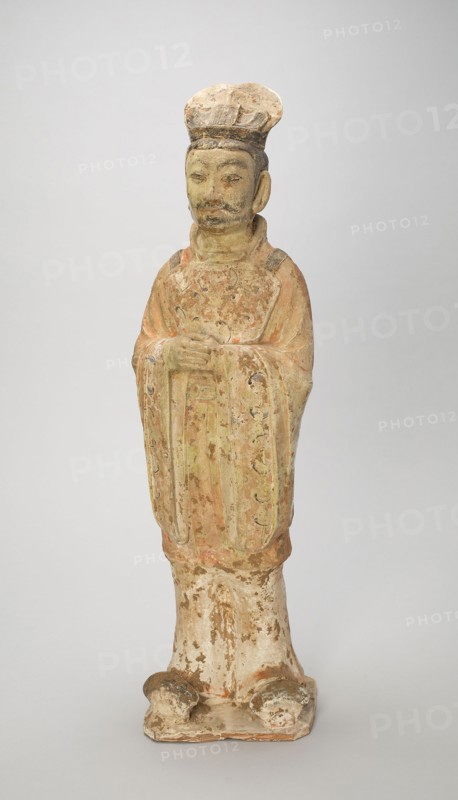 Standing Court Official, Style of Tang Dynasty (618–907) with later painted detail, China, Earthenware with painted decoration, 65.8 × 19.0 × 15.9 cm (25 15/16 × 7 1/2 × 6 1/4 in.)