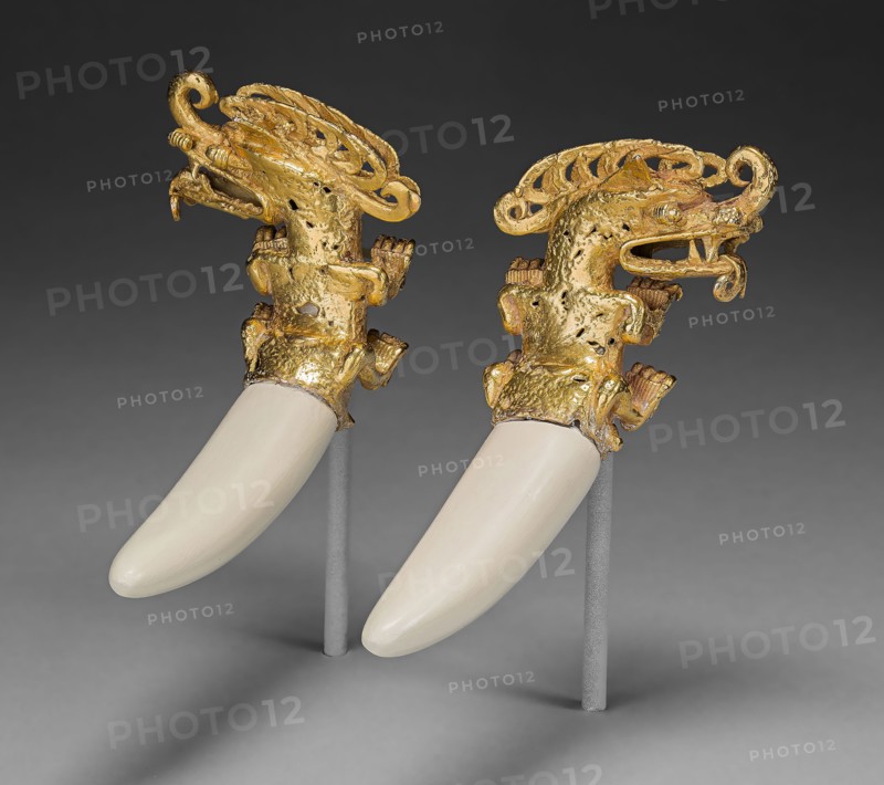 Double Pendant in the Form of a Mythical Saurian with Tusks, A.D. 800/1200, Coclé, Coclé province, Panama, Panama, Gold with plaster restoration of boar tusks, 6 × 7 × 2.32 cm (2 3/8 × 2 3/4 × 7/8 in.)