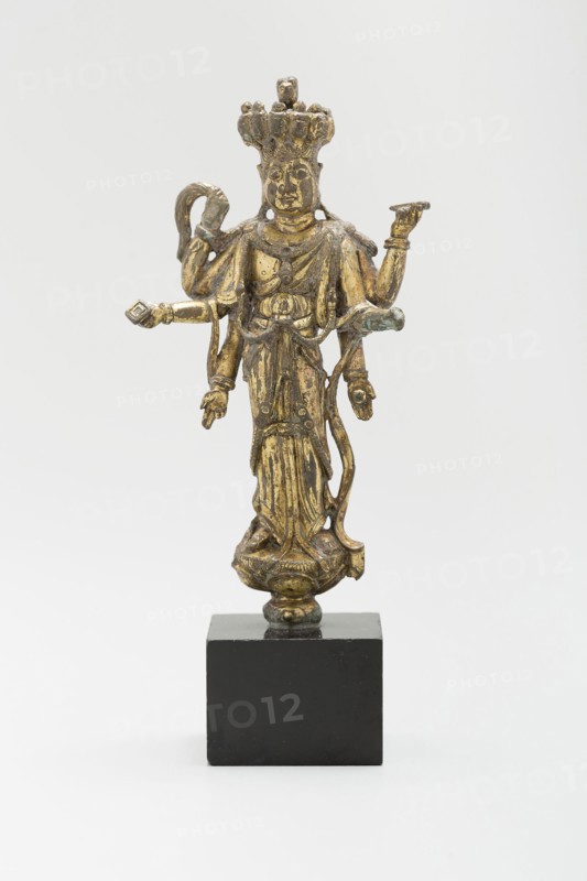 Eleven-Headed and Six-Armed Guanyin (Avalokiteshvara) Standing on a Lotus, Tang dynasty (618–907), c. 9th century, China, Gilt copper alloy, 9.3 × 3.5 × 2.5 cm (3 3/4 × 1 3/8 × 1 in.)