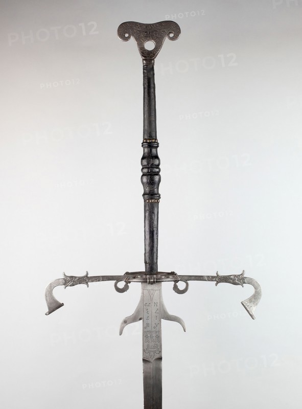 Two-Handed Sword for the Bodyguard of Julius, Duke of Brunswick-Lüneburg and Prince of Wolfenbüttel, 1573, Northern German, Brunswick, Northern Germany, Iron, steel, brass, wood, and leather, Overall L. 198.1 cm (6 ft. 6 in.)