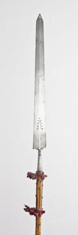 Partisan, late 16th century, Northern Italian, Northern Italy, Steel, wood, brass, velvet weave, and attached tassel, L. 280.67 cm (110 1/2 in.)