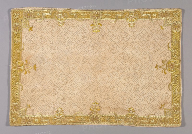 Pillow Sham, c.1720, England, Cotton, plain weave, underlaid with linen, plain weave, embroidered with silk floss and silk yarns in back, herringbone, individual satin, and satin stitches, laid work, couching, and French knots, 35.2 × 51 cm (13 7/8 × 20 1/8 in.)