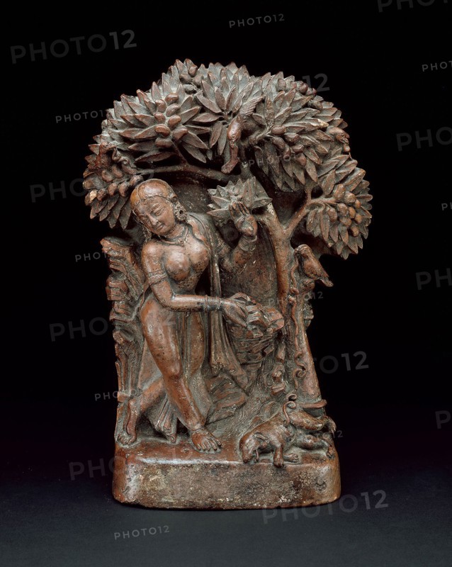 Mahasiddha Manibhadra Under a Mango Tree with an Evicerated Dog, 13th/14th century, Nepal, Nepal, Terracotta, 31.0 x 21.0 x 9.5 cm (12 3/16 x 8 1/4 x 3 3/4 in.)