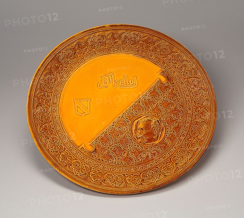 Othello Plaque, 1884, Made by Rookwood Pottery, American, 1880–1960, Modeled by J.C. Meyenberg, 1884, American, late 19th–early 20th century, Retailer: Duhme & Co., American, unknown, Cincinnati, White slip decorated earthenware with "Standard" glaze, Diam. 40.6 cm (15 1/4 in.)