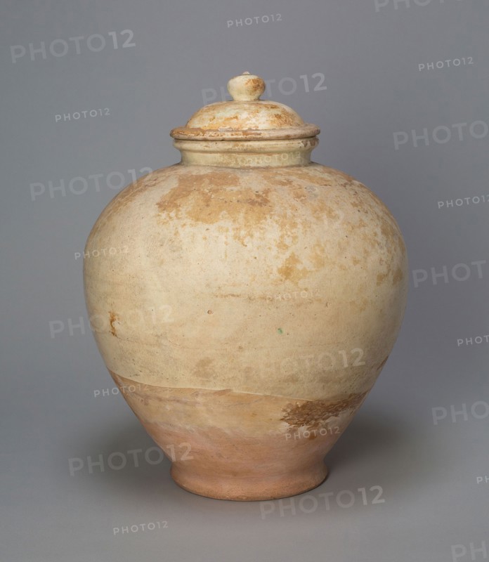 Covered Jar, Tang dynasty (618–906), early 8th century, China, Slip-coated earthenware, H. 35.6 cm (14 in.), diam. 27.6 cm (10 7/8 in.)