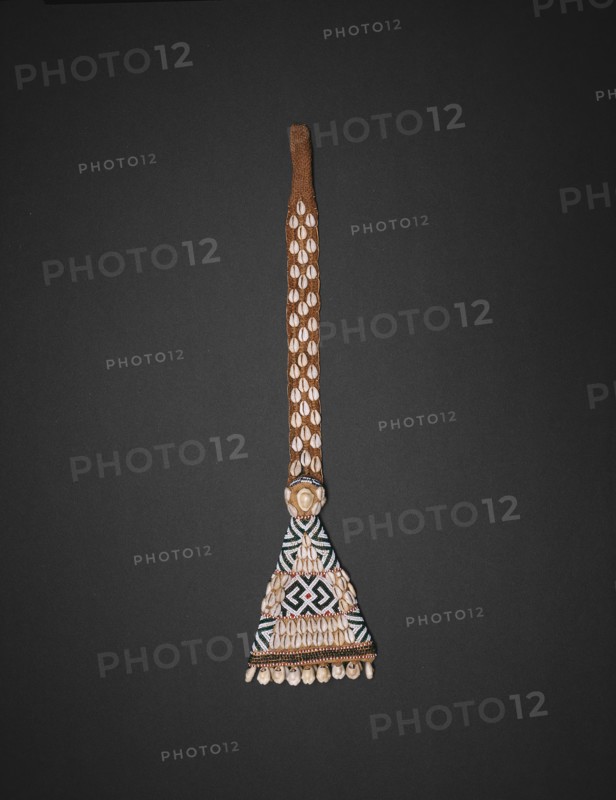 Pendant, 19th century, Kuba, Kasai region, Democratic Republic of the Congo, Central Africa, Democratic Republic of the Congo, Jute, raffia, cowrie shells, and beads, 54.6 × 14 × 2.5 cm (21 1/2 × 5 1/2 × 1 in.)