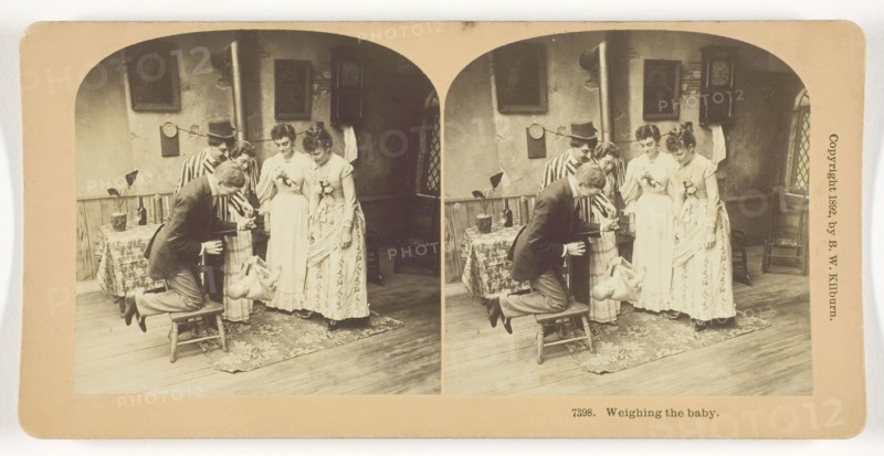 Weighing the Baby, 1892, B. W. Kilburn, American, 1827–1909, United States, Albumen silver print, stereo, 7.7 x 7.6 cm (each image), 8.8 x 17.7 cm (card)