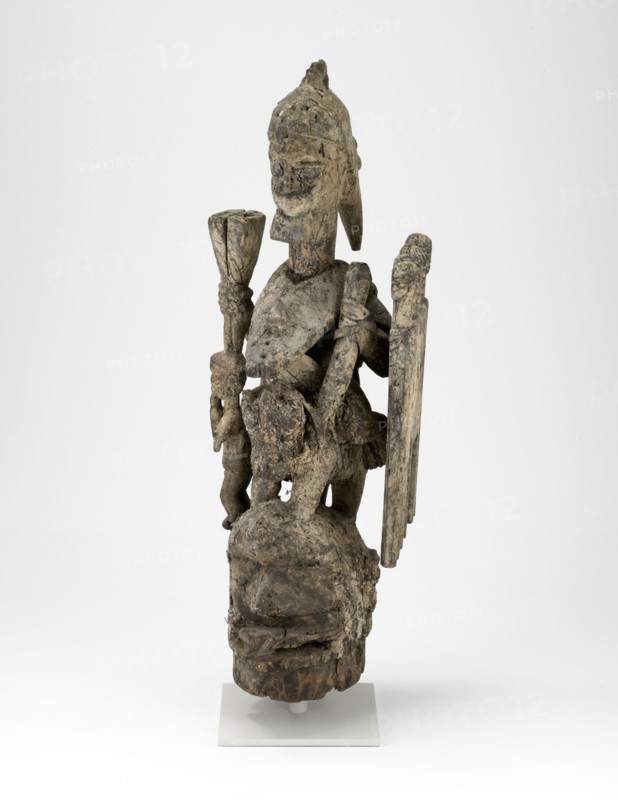 Headdress (Jagún Jagún), Mid–/late 19th century, Yoruba, Ekiti region, Nigeria, Coastal West Africa, Nigeria, Wood, iron, nails, fiber, and sacrificial materials, H. 111.8 cm (44 in.)