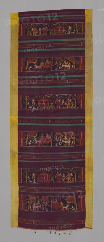 Khmer Pidan with Scenes from the Jataka Tales, Late 19th century, Cambodia, Cambodia, Center panel: silk, weft ikat weft-float faced 1:2 'Z' twill weave, side panels: silk, stripes of weft-faced 1:3 'Z' twill weave and stripes of plain weave, lower edge tape: silk, plain weave with attached gold- and silver-leaf-over-lacquered-paper-wrapped silk knotted cut fringe, center and side panels joined, 303.9 × 110.7 cm (119 3/4 × 43 5/8 in.)