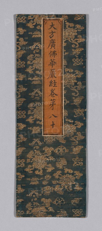 Sutra Cover, Ming dynasty (1368–1644), c. 1590’s, China, Silk and gold-leaf-over-lacquered-paper strips, plain weave with supplementary patterning wefts, label: silk, plain weave, painted with ink, over paper, 34.8 × 12.1 cm (13 3/4 × 4 3/4 in.)
