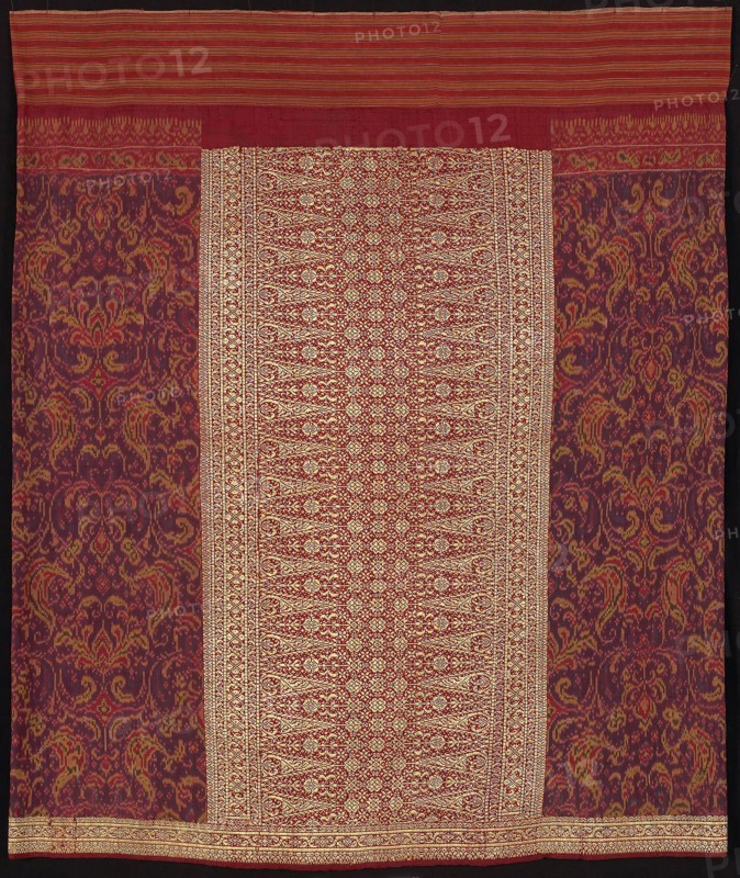 Sarong (sarong limar), 19th century, Indonesia, Bangka, Indonesia, Silk and gold-leaf-over-lacquered-paper-strip-wrapped silk, weft resist dyed (weft ikat), plain weave with supplementary brocading wefts, attached waistband of cotton, warp-stripe plain weave, 98.1 x 116.2 cm (38 5/8 x 45 3/4 in.)
