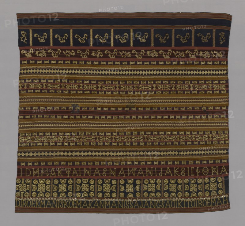 Woman’s Ceremonial Skirt (Tapis), 19th century, Abung, Indonesia, South Sumatra, Lampung, Indonesia, Two panels joined: cotton and silk, warp-faced, weft ribbed plain weave, embroidered with silk, gold-leaf-over-lacquered-paper strip wrapped cotton, cotton, gilt-metal coils, gilt-metal wire wrapped cotton, gilt-metal-strip wrapped cotton and gilt-metal spangles in running stitches, laidwork, couching, and padded couching, 114.5 x 122 cm (45 x 48 in.)