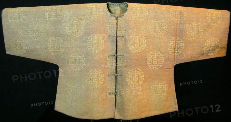 Woman’s Riding Jacket, 18th century, Qing dynasty (1644–1911), China, Silk and gold-leaf-over-lacquered-paper strip, slit tapestry weave, edges with silk, rayon and gold-leaf-over-lacquered-paper strip satin weave with plain interlacings of secondary binding warp and patterning wefts, lined with silk, plain weave, 77.2 × 154 cm (30 3/8 × 60 5/8 in.)