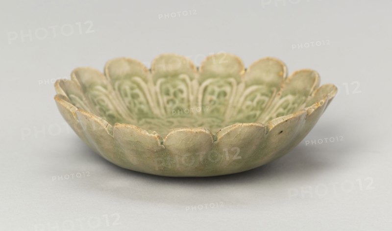 Scalloped Dish with Stylized Floral Sprays and Sickle-Leaf Scrolls, Northern Song (960–1127) or Jin dynasty (1115–1234), 12th/13th century, China, Yaozhou ware, glazed stoneware with underglaze molded decoration, H. 2.5 cm (1 in.), diam. 9.3 cm (3 11/16 in.)