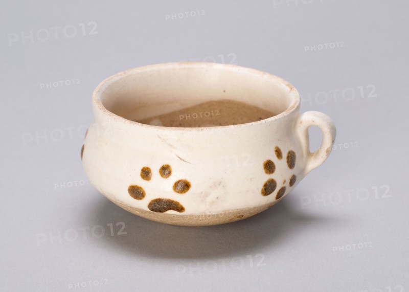 Ring-Handled Cup, Jin dynasty (1115–1234), China, Cizhou-type ware, white-glazed stoneware with iron spots, H. 3.4 cm (1 3/8 in.), diam. 6.6 cm (2 5/8 in.)
