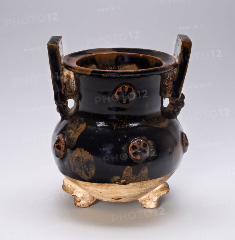 Tripod Vessel with Squared Handles, Wheel Patterns at Neck, Northern Song (960–1127) or Jin dynasty (1115–1234), c. 12th century, China, Stoneware with molded/applied relief and iron brown glaze, H. 15.0 cm (5 15/16 in.), diam. 12.0 cm (4 3/4 in.)