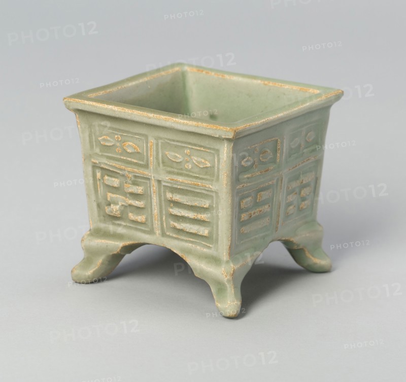 Square Jar with Archaistic Trigrams and Floral Scrolls, Yuan (1271–1368) or Ming dynasty (1368–1644), c. 14th/16th century, China, Longquan-type ware, stoneware with underglaze molded decoration, 6.6 × 7 × 7 cm ( 2 5/8 × 2 13/16 × 2 13/16 in.)