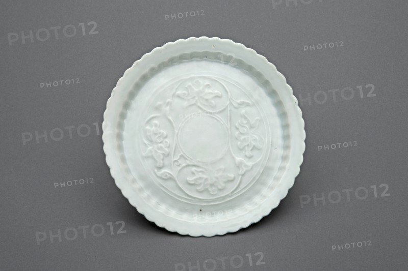 Lobed Dish with Lotus Scrolls, Yuan dynasty (1271–1368), first half of the 14th century, China, Luanbai (eggshell white) ware, porcelain with underglaze molded decoration, H. 1.6 cm (5/8 in.), diam. 5.8 cm (2 1/4 in.)