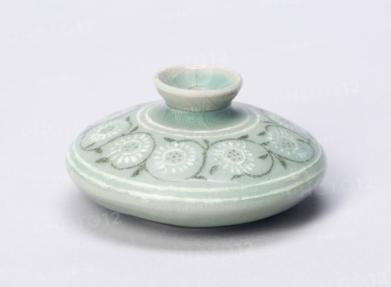 Oil bottle with Chrysanthemums, Goryeo dynasty (918–1392), 13th century, Korean, South Asia, Stoneware with underglaze inlaid decoration of black and white clays, H. 4.0 cm (1 5/8 in.), diam. 7.9 cm (3 1/8 in.)