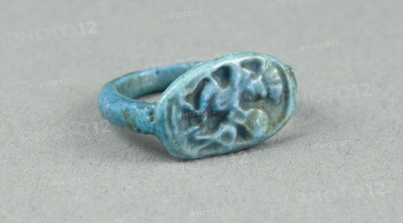 Ring: Figure of Bes playing frame drum, sa (protection) before him, New Kingdom, Dynasty 18 (about 1390 BC), Egyptian, Egypt, Faience, H. 1 cm (3/8 in.), diam. 2.2 cm (7/8 in.)