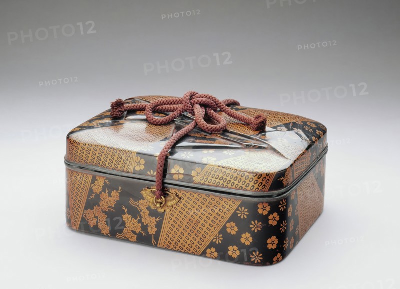 Unknown (Japanese), Cosmetic Box with Designs of Silk Incense Wrappers, 16th Century, Black and gold lacquer on leather and wood with silk cords and metal fittings, Overall: 4 3/4 inches × 11 inches × 8 5/8 inches (12.1 × 27.9 × 21.9 cm)