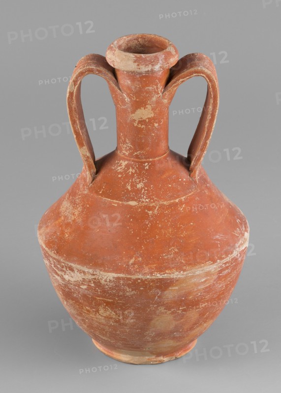 Amphora, unknown Roman workshop, Roman pottery, 1st–2nd century, Rome, Gaul France; vessel amphora; height 14.6 cm, width 9.6 cm 0.146 m × 0.096 m, A worn terracotta vessel with a bulbous body, narrow neck, flared rim, and a pair of high curved handles extending from the neck to the shoulder, showing surface abrasions and patches of lighter wear against the dominant reddish-brown color, set against a plain neutral gray background.