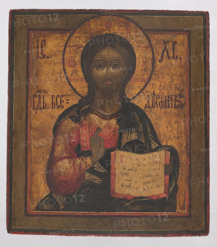 Icon: Christ Pantocrator. Russian workshop. Jesus Christ Bible; icons; book iconography; Christ Pantocrator iconography; inscriptions. In the center Christ is shown frontally, holding the open Gospel book in his left hand and blessing with his right. He wears a vermilion, gilded chiton with a sash patterned with stars and a dark green himation. The garment folds are fine, stylized in a 17th-century baroque manner. The Savior’s face, with an olive complexion, is elongated and ascetic, framed by long brown hair and a pointed beard. On both sides are the letters of the Christological monogram IC XC and the inscription Lord Almighty. The background and the cruciform halo are gilded; the frame is muted green. 19th century, Russia. Height 36 cm, width 31.5 cm., A painted icon showing a central frontal figure with a halo behind the head, wearing layered robes in shades of red, dark green, and black, with visible gold and ochre background tones; the face and hands are painted in brownish skin ...