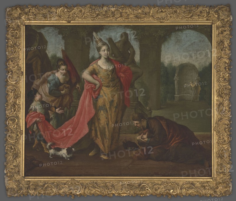 Genre scene in the park, unknown author, 1st half of the 18th century, painting, height 50.1 cm, width 63 cm, A painted scene framed by an ornate gold frame shows a woman standing centrally wearing a gold dress with blue accents and a red drape, a crown on her head, and a hand on her hip; to her left a woman in blue and brown kneels or leans while a child in muted clothing holds part of the red drape and a small white and black dog stands near their feet; to the right a man in dark brown and red robes kneels or bows on the floor with his hands clasped, and a dark object lies near him; the background contains stone columns and arches in shades of gray and green, a distant stone structure and a small standing figure in muted colors, and the overall palette includes gold, red, blue, brown, green, gray, black, white, and muted flesh tones.