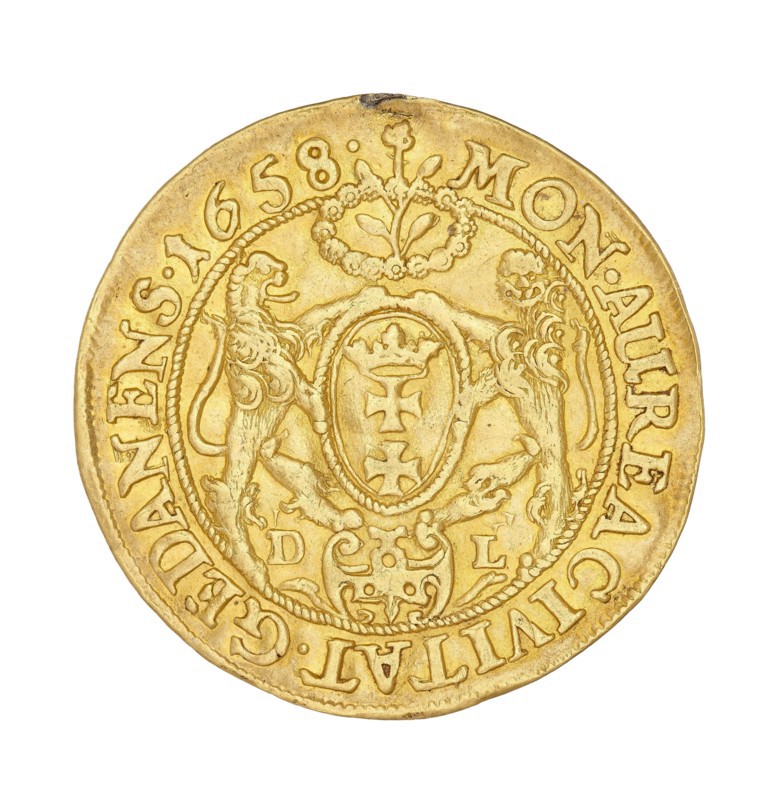Gdansk ducat; Lesse, Daniel mintmaster, 1656–1685 co-creator; John II Casimir Vasa King of Poland, 1648–1668 author; Poland; Gdansk; coin, A round metallic object with a golden-yellow color, showing an ornate central shield flanked by two stylized animals and topped by a decorative floral motif, surrounded by a raised circular border and an outer band of embossed characters, with variations in the gold tone and small darker spots and wear marks on the surface.