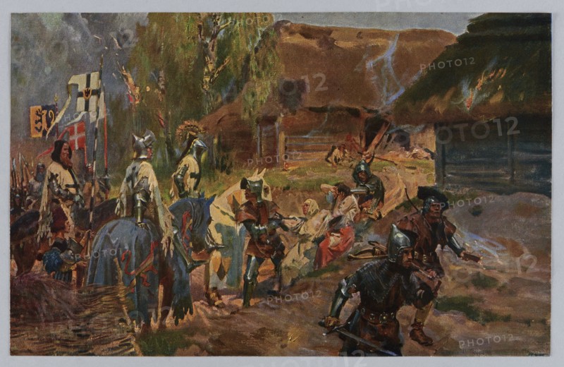 Wojciech Kossak 1856–1942, Hunting for people: The Teutonic apostolate; page from the Prussian Spirit portfolio, 1912. Illustration/print after a painting, reproduction of a work of art; portfolio of reproductions/album page; print: 17.5 × 27.6 cm; cardboard: 29.6 × 39.3 cm. Makers: Wojciech Kossak artist; Zaklady Graficzne B. Wierzbicki i S-ka printer/publisher. Subjects: historical scenes; Polish painting., The image shows a painted outdoor scene with a group of armored figures and horses near a cluster of thatched buildings. The colors include browns, greens, grays, blues, and touches of red and yellow. Several figures wear metallic helmets and armor in silvery and gray tones, and a few wear darker brown or black clothing and hats. A group of horses appears with blue and pale coats and decorative cloth in darker colors. In the background there are thatched roofs with areas of darker brown and some lighter smoke-gray brushstrokes rising near them. A few figures sit or recline on the ...