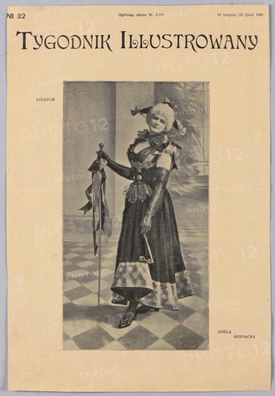 Reproduction of a painting: Aniela Biernacka 1858–1918, Studyum; painting; Polish painting; reproduction; women; female portrait; costumes; 1901; press illustration; reproduction of a work of art., A grayscale illustration of a standing woman wearing a long dark dress with a lighter patterned hem, long gloves, and a large bow at her neck, holding a tall staff with flowing ribbons in one hand and a small object in the other, posed on a checkered floor in front of a plain backdrop with some indistinct shapes, with the image centered on a beige page showing a wide margin around it; visible colors are beige and shades of gray and black.