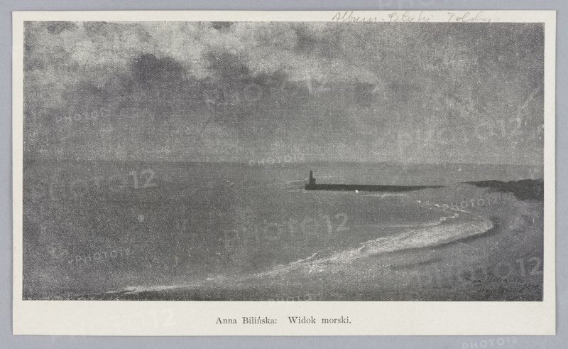 Reproduction of a painting: Anna Bilinska-Bohdanowicz 1857–1893, Sea View, 1890; painting; Polish painting; sea coasts, seascapes, beaches, landscapes; book illustration; reproduction of a work of art., A grayscale scene showing a coastline with a calm sea meeting a curved shoreline, a low breakwater or jetty extending into the water with a small vertical structure at its end, gentle waves creating lighter textured foam along the shore, a distant low headland or rocky outcrop on the right, an expansive cloudy sky above, and a pale border surrounding the image.