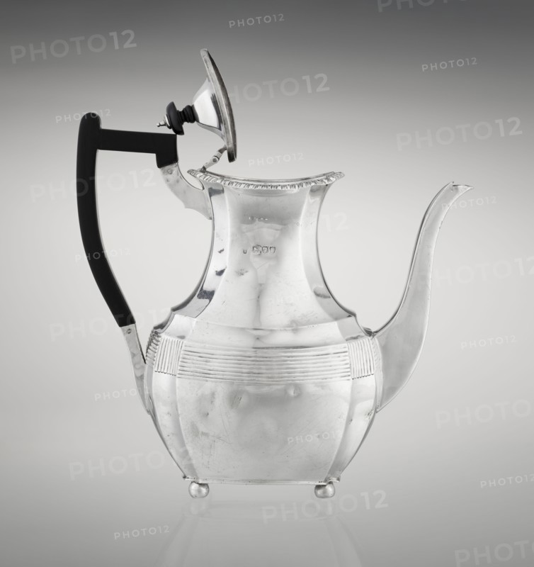 Coffee pot by Harris, CS & Sons London, goldsmiths' firm, active 1817–1933 and Charles Stuart Harris maker, fl. 1852–1897. Scrapped/purchased, Pear-shaped, ribbed silver coffee vessel with godron ornaments; belly decorated with a band of narrow half-cylinders and grooves. Supported on four profiled, ball-shaped legs. High side spout-like handle; contemporary wooden handle on axis set in silver sockets. Upper edge edged with godron band; hinged lid domed in center, topped with a bowling-pin finial. Dated 1895–1896. Great Britain London, England. Height 21.2 cm; width 18.5 cm; depth 10 cm; weight 640 g., A shiny metal teapot with a reflective silver surface and a black handle, featuring a hinged lid that is open and a curved spout, sitting on small rounded feet against a gray gradient background; the teapot shows smooth and ribbed decorative bands and slight surface scratches, and the lid has a small black knob with metallic fittings.
