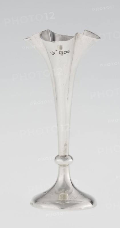 Chalice-shaped vase, Woodward, Horace & Co Ltd Birmingham, London; fl. ca. 1851–1919 maker, scrap - purchase, flowers vessel, pearling ornament. Vase supported on a circular foot, transitioning into a short stem terminating in a ring, with a goblet in the form of a slender flower calyx; tall, conical, quarter-part at the top, edged with pearling. 1899/1900. Great Britain, England, London. Vessel. Height 12.5 cm; width 5.5 cm; depth 5.5 cm; weight 38 g., A tall, slender metal vase with a flared, scalloped rim sits on a rounded stem and bell-shaped base, all rendered in a reflective silver color; the surface shows a few areas of tarnish and small scratches, and the rim has a subtle beaded edge.