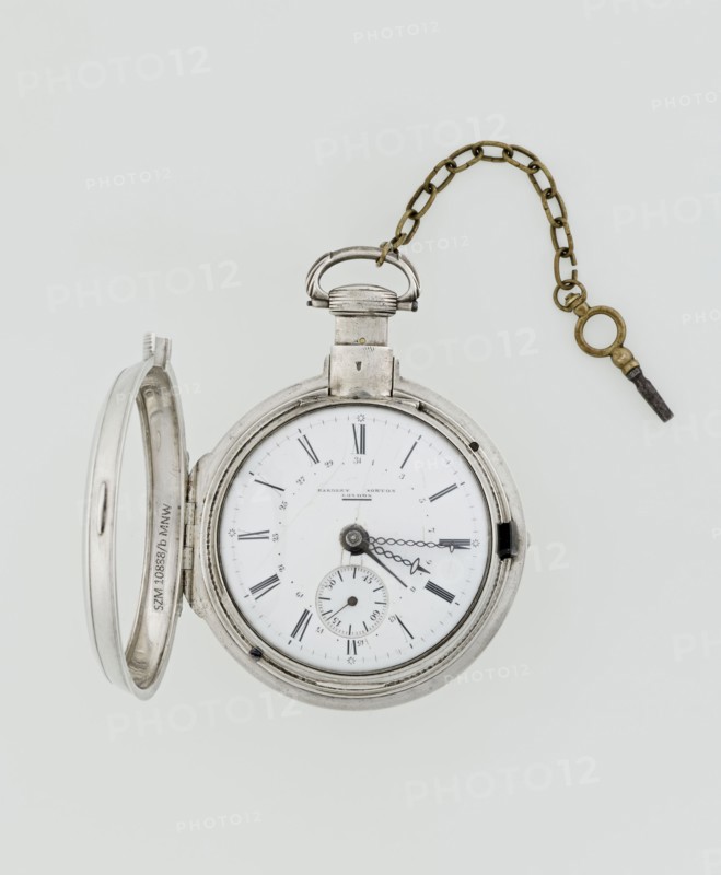 Pocket watch with key, Norton, Eardley fl. 1770–1792 born 1728, died 1792. Case made in Germany, 3rd quarter of the 18th century; movement by Eardley Norton, London. Pocket repeater in two silver cases: smooth outer case; inner case with framed glazed lid and a mechanism cover engraved with an openwork floral twig, winding hole, and bell. White-enameled dial with black Roman hour numerals, minute scale marked with dashes, calendar with Arabic numerals, three steel hands hour and minute in openwork weave, third straight for day of month, and small seconds subdial with Arabic numerals. Dial signed “EARDLEY NORTON / LONDON.” Movement: gilded brass frame with circular plates connected by pillars, spring-driven with spindle escapement; lower plate with openwork crown richly decorated with acanthus tendrils and engraved acanthus volutes; cut-out reserve engraved “Eardley / Norton London.” Preserved winding key on a chain. Timepiece; height 8 cm, width 6.2 cm, dial diameter 5.3 cm., A metalli...