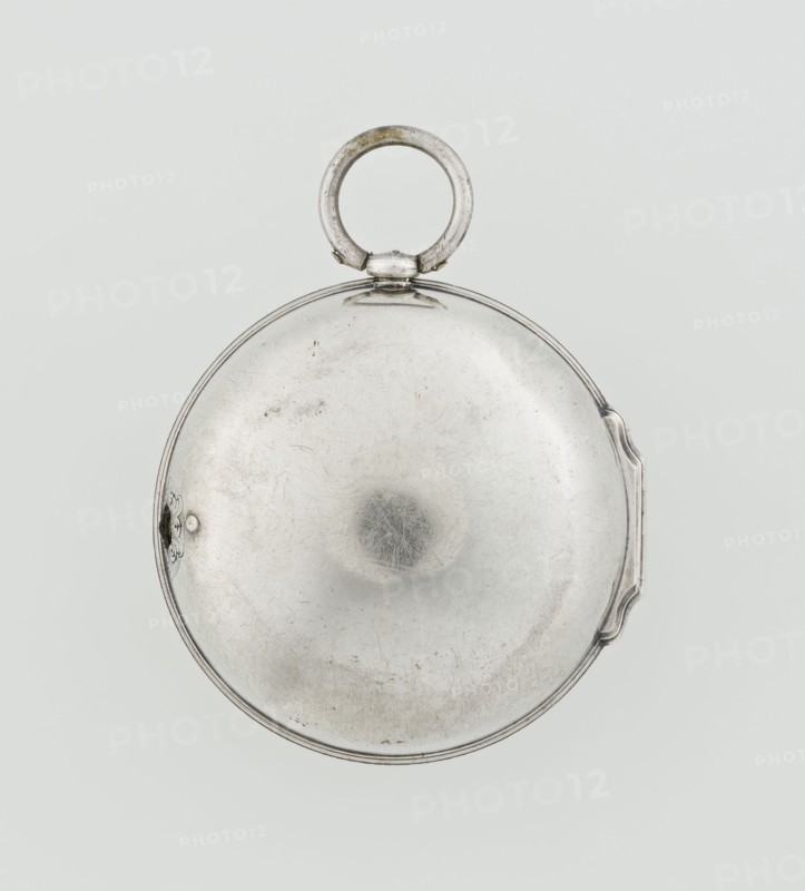 Pocket watch by John Bushman 1692–1720. Silver pocket watch in three cases: outer case covered with leather, decorated on the rim with studded silver rosettes; middle and inner cases plain. On the underside of the inner case the casemaker's initial H and the number 3081. Transparent lid. Silver champlevé dial with Roman numeral hour markers and Arabic minute markers in oval reserves on a matte background; central circular reserve with the watchmaker's signature on two semicircular plates reading BUSHMAN and LONDON; date window at the bottom. Steel hands with openwork hour hand. Movement with a plate skeleton, spring drive, worm gear, and Gall chain. Spindle escapement. Gilded lower plate with an openwork English-style bun in the form of a wreath filled with acanthus tendrils and an openwork grid, connected by a mascaron mask with an openwork bun foot. Hair adjustment is a rotating silver-plated dial with a scale I–VI. Engraved on the plate in italics: Jn Bushman 3081 / LONDON. Dated c....