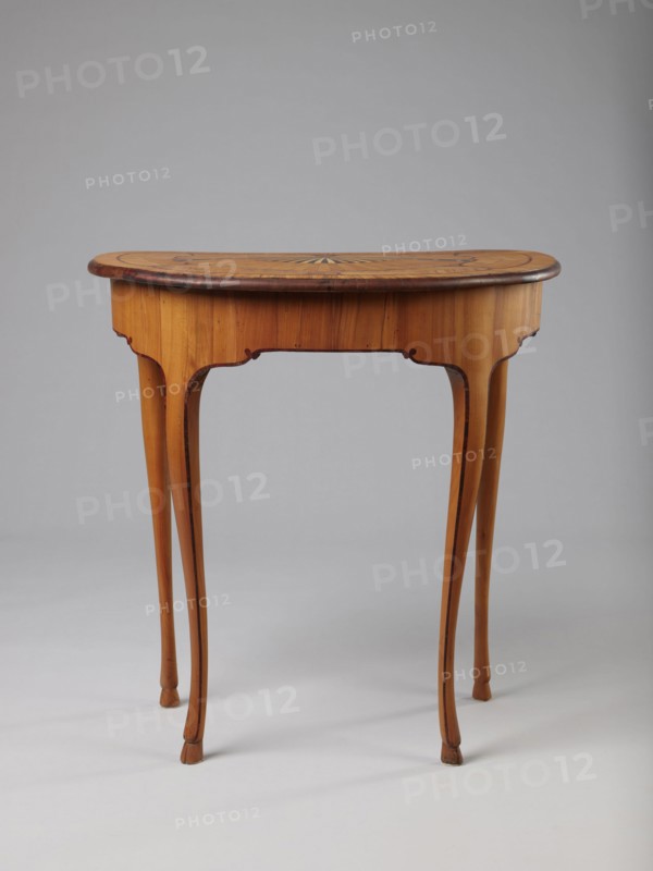 Table, Auxiliary table, ca. 1730–1750, Saxony . Height 72.5 cm, width 71.5 cm, depth 46.2 cm. Supported by four slender, slightly curved S-shaped legs framed and bound with a rosewood ribbon; feet in the form of hooves, stained black. Front frame concave with a small central drawer. Tabletop decorated centrally with a fan enclosed by four fields separated by a ribbon of irregular, rounded outline and a narrow crosswise frame. Fan setting inlaid with mother-of-pearl rosettes, entire surface bound with tin veining; lower part of fan features alternating light and dark areas. Tabletop edge veneered with yew solid wood. Mortise lock, single-bolt with brass plate. Ornament: fans, ribbon-and-pincer; animal legs hooves., A wooden table with a semi-circular top and a warm light-brown finish stands on slender, curved legs; the tabletop shows a darker brown edge and a subtle radial inlay pattern in the center, and the legs and apron display gentle curved cutouts and slender tapering forms; the s...