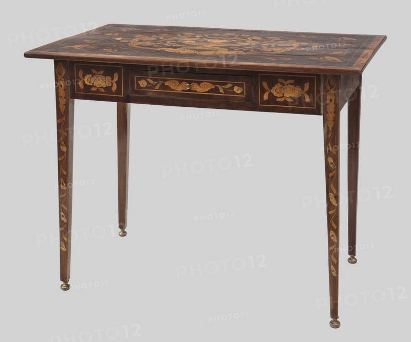 Table, birds, plant ornament, vases with flowers, classicism style, late 18th century, Netherlands, furniture, table, height 73 cm, width 89 cm, depth 56 cm, A wooden table with a rectangular top and tapered legs, featuring decorative inlaid floral patterns in lighter wood tones against a darker brown surface; the tabletop and apron show ornate floral marquetry, the legs have vertical vine-like inlay, and small round metal feet are visible at the leg ends; the colors visible include dark brown, light brown, golden wood tones, and small brass-colored accents, set against a pale gray background.