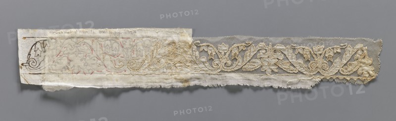 Two fragments of appliqués on batiste tulle. a/ with a floral tendril pattern. b/ with a fragment of cardboard sewn on. 19th century, Europe. Varia, clothing accessories, fabric. Width 5.5 cm, length 34 cm., A long narrow strip of fabric laid flat against a gray background showing a decorative lace border with an embroidered floral and scroll motif in beige and off-white tones, attached to a backing of frayed, semi-sheer white or cream cloth with faint traces of pinkish stitch marks and darker beige smudges; the lace has a fine mesh ground and features flowing leaf and flower shapes in a slightly darker beige thread, while the backing includes a small piece of stiffer white or cream paper or fabric at one end with a simple dark brown decorative mark.