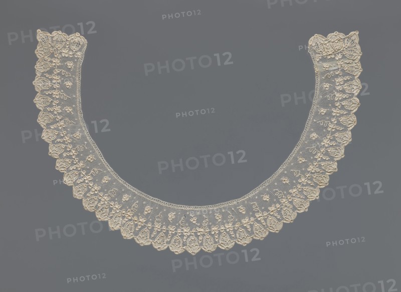 Collar, Repossession, Women's clothing accessory, lace, 19th century, France . The collar is a band of equal width, arched, with a floral ornament set against a mesh background. On the rim is a row of flower calyxes branching from a continuous branch decorated with small quatrefoils. Width 3.5 cm, length 46 cm., A delicate circular lace collar displayed against a plain background, the lace rendered in a creamy off-white color with intricate floral and scalloped edge patterns, the background a uniform medium gray; the collar shows a fine netting with embroidered floral motifs and a repeating scalloped border, creating a symmetrical rounded shape.
