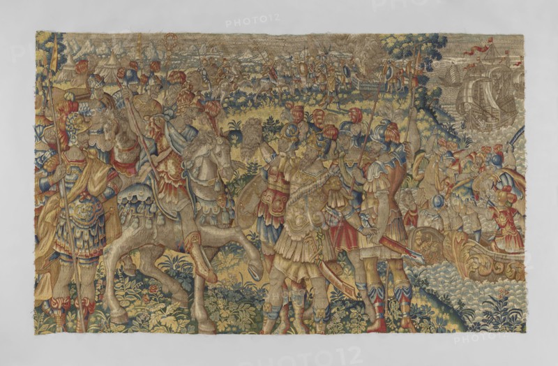Figural tapestry by Franz Geubels 1535–1590, 2nd half of the 16th century, Brussels. Tapestry depicting a battle scene: in the foreground center a victorious general Caesar on horseback; a soldier in front holds the severed head of Pompey, with two soldiers at the sides. Foreground right shows a leader on horseback with a soldier holding a severed head and other soldiers nearby. Background right is a seascape with ships filled with troops; background middle and left show tents, troops on horseback, and a bonfire lit on the seashore. High horizon with an outline of mountains. Materials: woven decorative fabric; colors limited and saturated—green, red, sapphire, sand, and yellow. Dimensions: height 212 cm, width 347 cm. Border clipped / no border., A richly detailed woven scene fills the image, dominated by warm golds and tans with accents of blue, red, green, and beige. Several figures in ornate armor and plumed helmets stand and ride horses across a landscape of stylized foliage and ro...