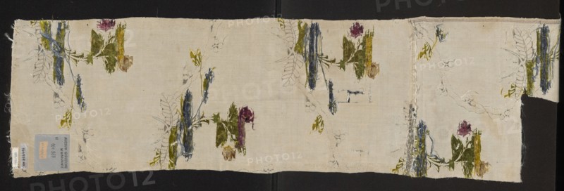 Fabric fragment, silk fabric fragment, patterned silk, 18th century, France. Preservation: fragments with preserved selvedge edge width 0.7 cm. White background with a grosgrain weave Gros de Tours with a small liseré motif, brocaded with colorful threads depicting delicate rose twigs and silver twisting vine-ribbons. Brocade thread colors: green, celadon, lemon, pale pink, pale blue, raspberry, plum, paint. Metal threads: silver lamellar, frisé silver, and metal thread with silver braid S. Dimensions: length 39 cm report, overall height 98 cm, width 23 cm., A rectangular piece of light-colored fabric lies flat against a dark background, with frayed edges and a narrow strip folded at one end; scattered across the fabric are a few floral motifs rendered in painted and stitched textures showing greens, blues, purples, yellows, and browns, with some areas of loose thread and faint pencil or ink sketch lines tracing leaf and stem shapes; the fabric surface shows slight creases and irregula...