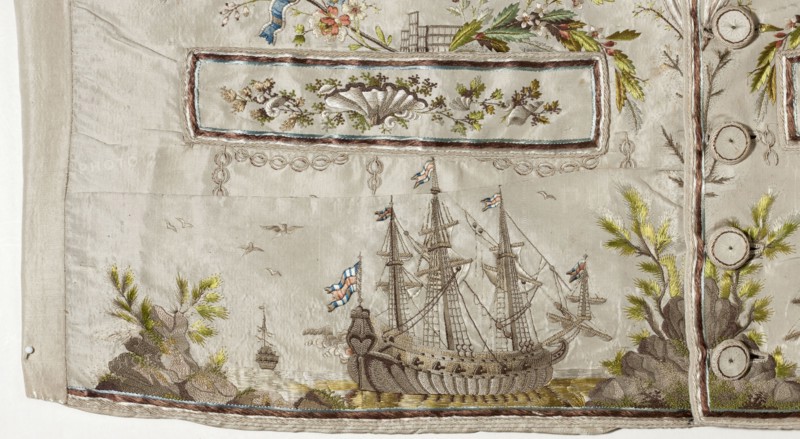 Vest, repossession provenance; subject motifs: ships, seascapes, shells, plant ornaments. Fashion: men's clothing. Vest made of cream silk grosgrain, straight cut, collarless, with flaps, fastened with covered buttons at the bottom marked by pocket flaps. Richly embroidered front, laced canvas back, silk lining. Embroidery background with small floral motifs; along the fastening are flower sprigs and grass. Chains around the pockets; above the pockets are flowers, a fragment of a stork's nest, and a seagull. Sea vegetation and shells adorn the pocket trim. Beneath the pockets is a fragment of a seascape with two three-masted ships and a small ship in the background. Flat embroidery using satin, laid, and knotted stitches; untwisted and twisted silk yarn. Predominant colors: green, gray, and salmon. Date: 1780s. Origin: Silesia, France. Garment length: 70 cm., A pale fabric panel with embroidered scenes and decorative borders, showing a large sailing ship with tall masts, rigging, and s...