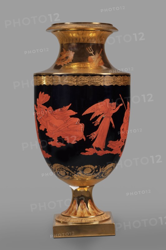 Amphora vase with a retinue of Greek gods; early 19th century, Germany, Berlin. Ovoid body with a separated recess and slightly upturned neck, on a spool foot and square plinth. Black body with overglaze-painted red-figure scene: Zeus on a throne surrounded by the Muses, Neptune Poseidon with Amphitrite, and Athena . Traces of gilded and engraved antique-looking floral ornament around the edge under the neck, the lower part, and the neck under the rim. Golden neck and foot painted in sepia and brick brown with five compositions featuring an eagle, a shield, a sword, a helmet, a dove, a floral wreath, and Neptune's attributes; a trail of leaves surrounds the foot. Foot mounted with a belly on a spindle., A tall decorative vase standing on a square base with a pedestal, showing a glossy black body decorated with orange-red figures of winged and robed human forms on cloud-like shapes, a band of ornate gold scrollwork and floral motifs near the top and bottom of the main body, and addition...